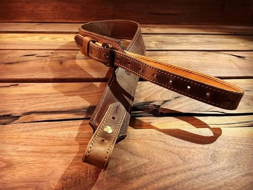 Latigo Classic Rifle Sling crossed laying on table